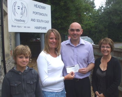 Shelley Butler, Chairman of Victory AC presents the £1200 cheque to Portsmouth Headway Charity